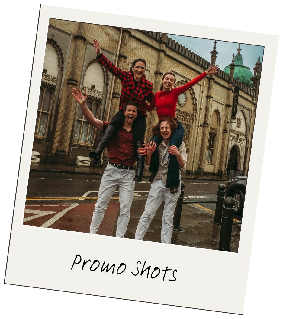 Four band members posing outside Brighton Royal Pavilion