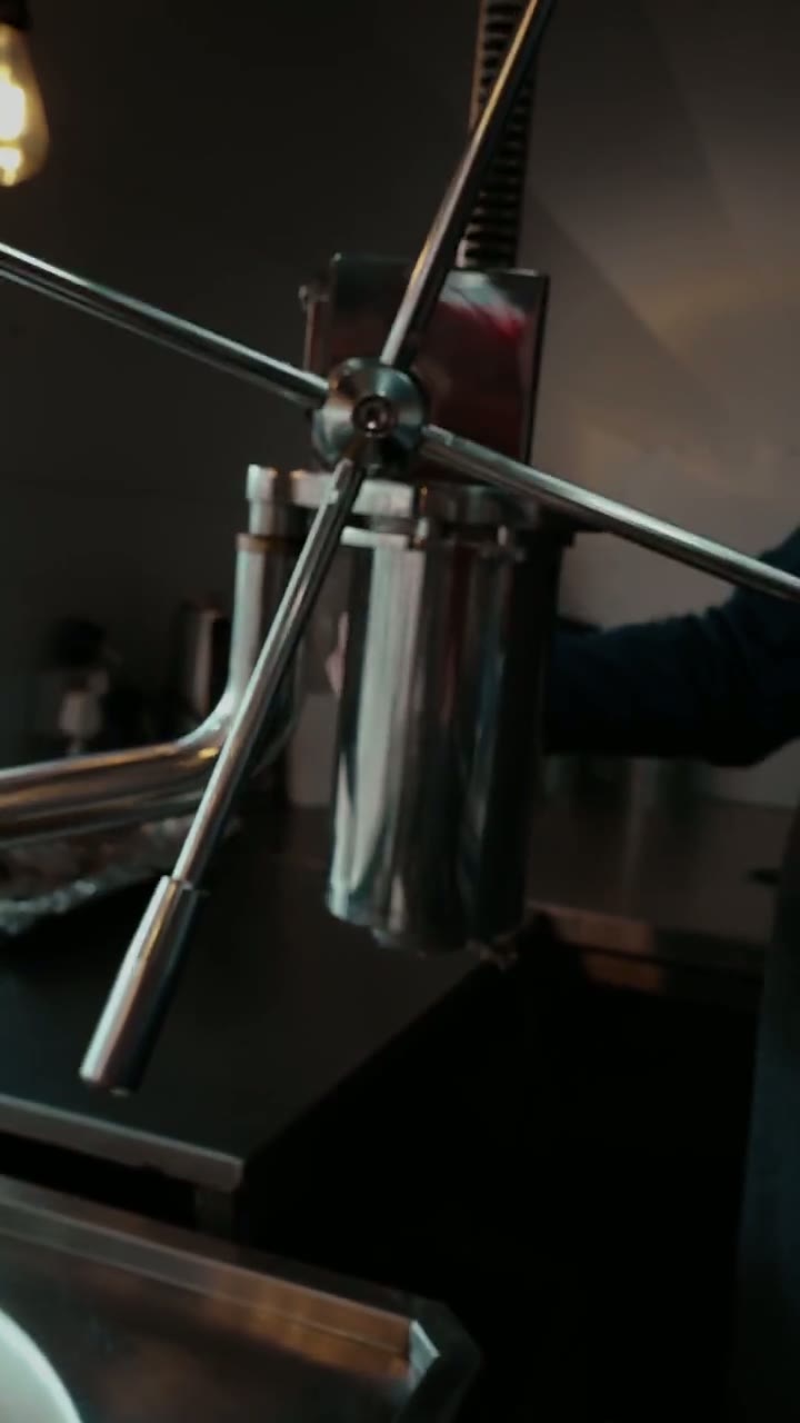 Churros being freshly pressed in the kitchen
