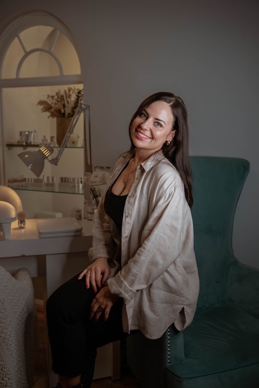 Ania seated in her beauty studio