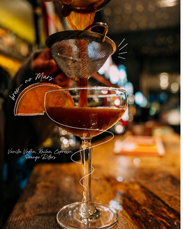 Brew No Mars cocktail being strained into a coupe glass